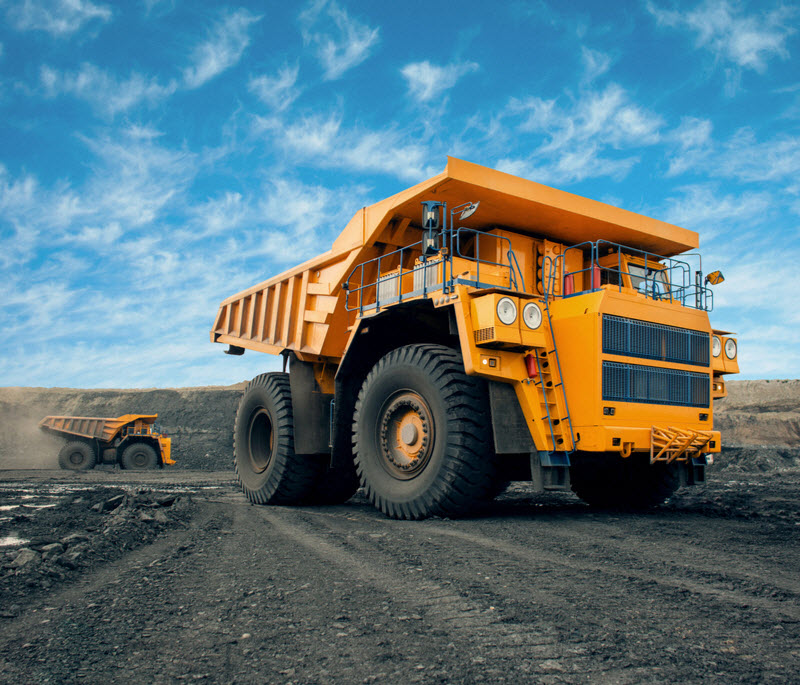 A large quarry dump truck in a coal mine