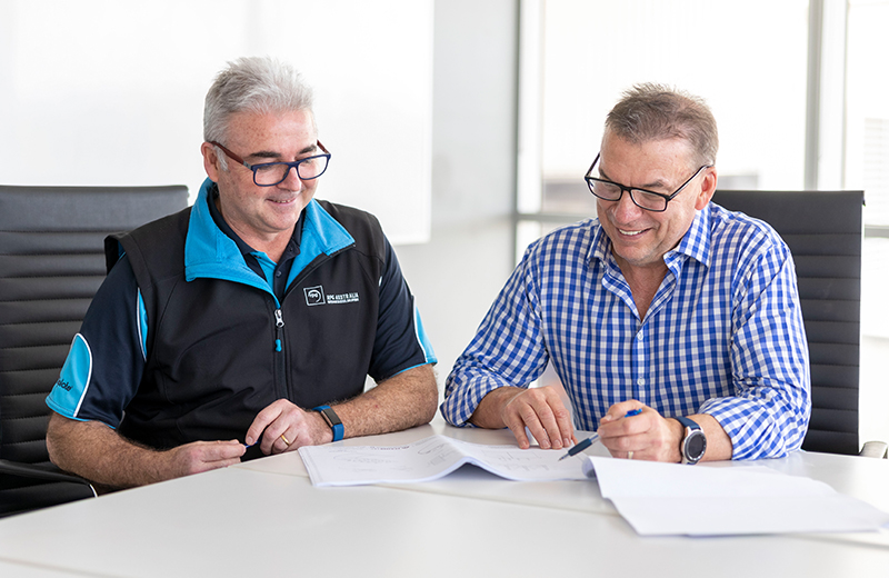 Two business partner reviewing documents